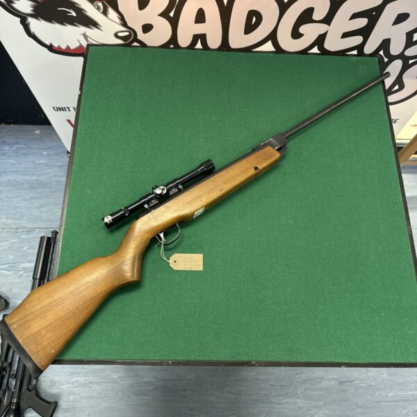 Full view of vintage Webley Vulcan .22 air rifle with scope.