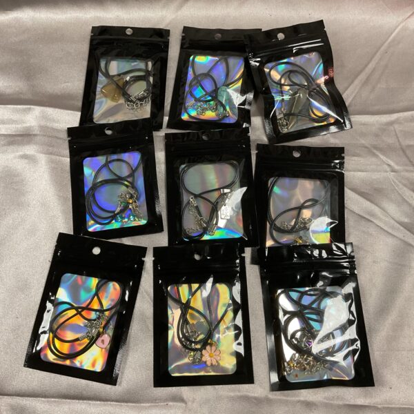 Lot of nine vintage silver-tone pendant necklaces.