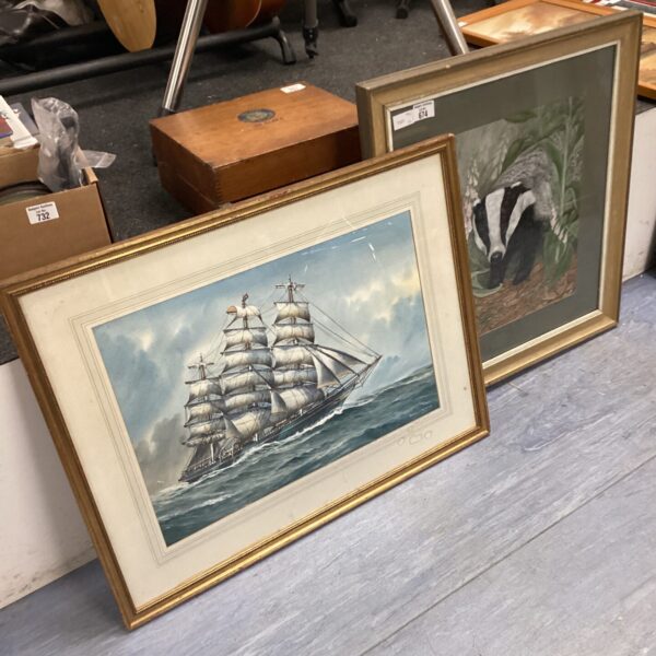 Vintage framed painting of a sailing ship at sea.