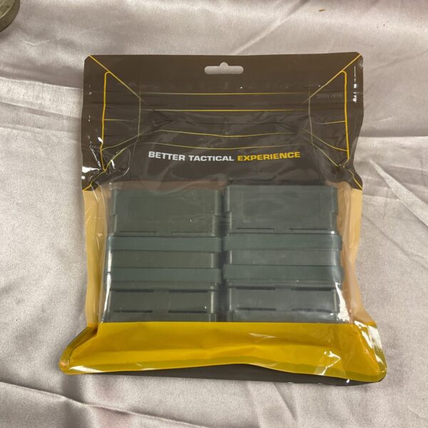 New tactical mag holders, model 223556, in sealed packaging.