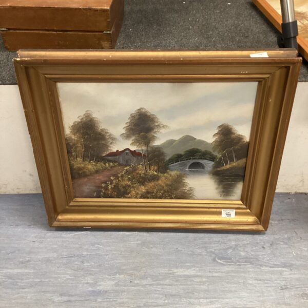 Signed cottage oil painting with river landscape and gilt frame.