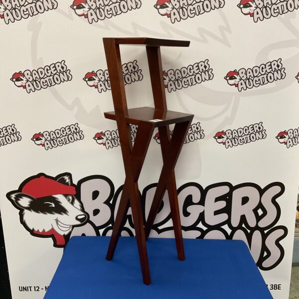 Vintage mahogany pot stand with two tiers and scissor legs.
