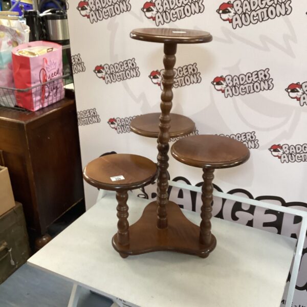 Vintage mahogany three-tier plant stand for home decor.