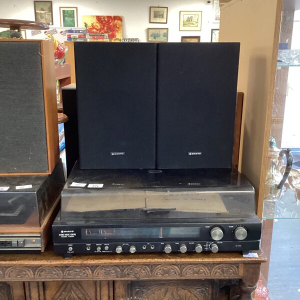 Vintage Sanyo stereo system with tower speakers, front view.
