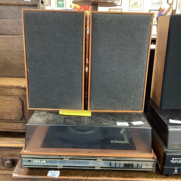 Vintage HMV stereo system with turntable and speakers on display.