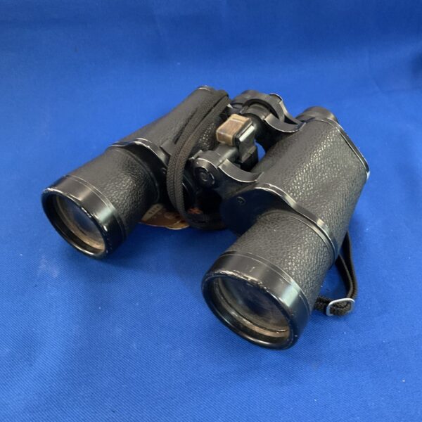 Front view of vintage Zenith binoculars with textured black body.