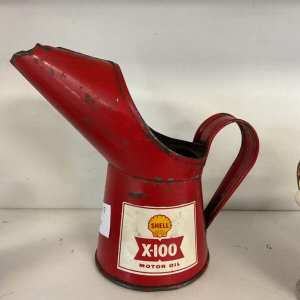 Vintage Shell motor oil can with red and yellow branding.