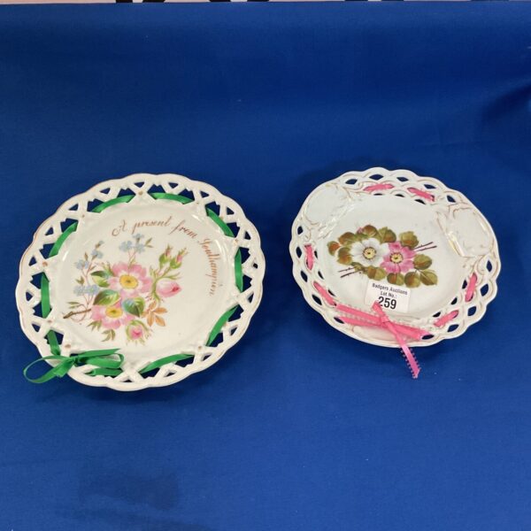 Antique Bohemian porcelain plates with pierced floral design.