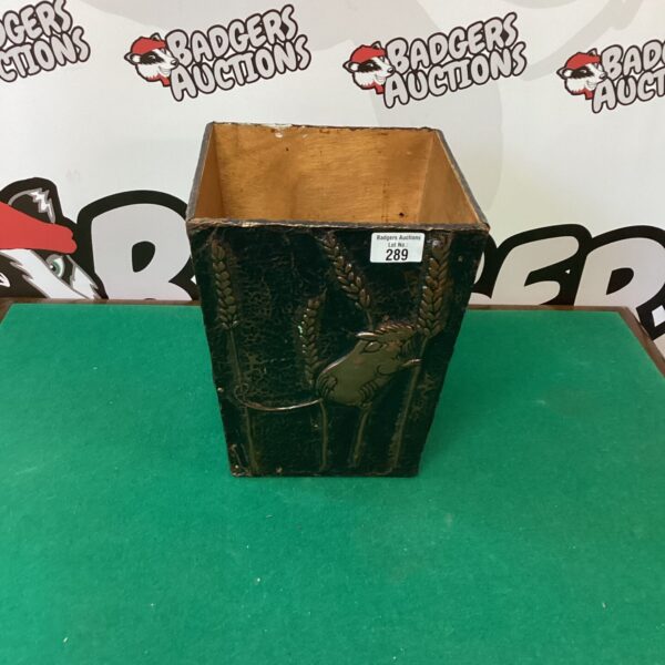 Vintage copper kindling basket for firewood storage.