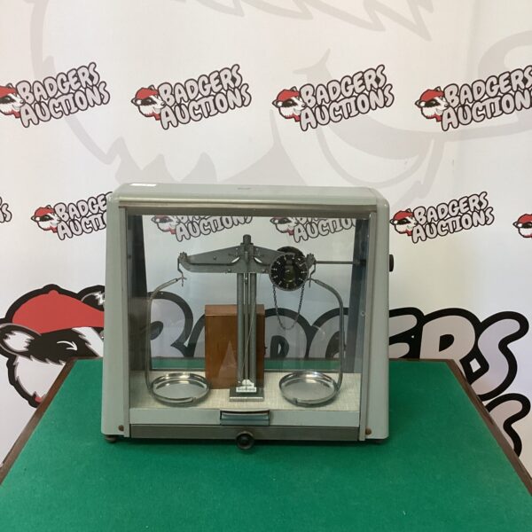 Antique Griffin scales with brass weights for precise measurement.