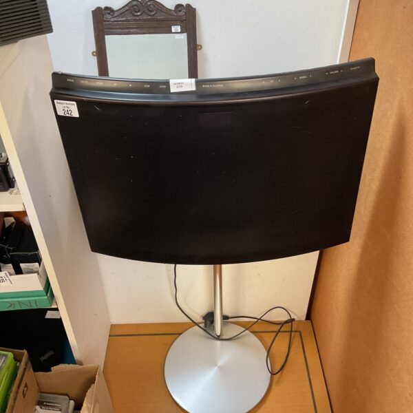 Black Bang & Olufsen BeoSound CD radio player on stand.