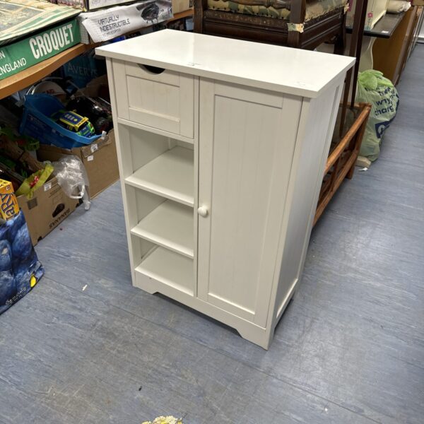 White laminated cabinet unit with a single door.