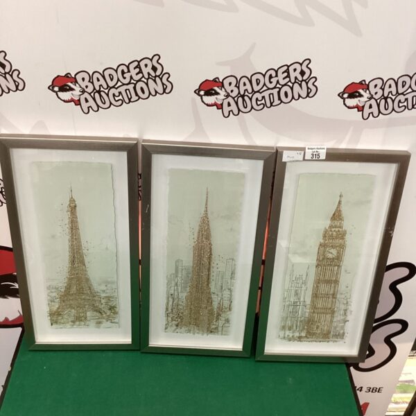 Glitter framed prints of London, Paris, and New York cityscapes.