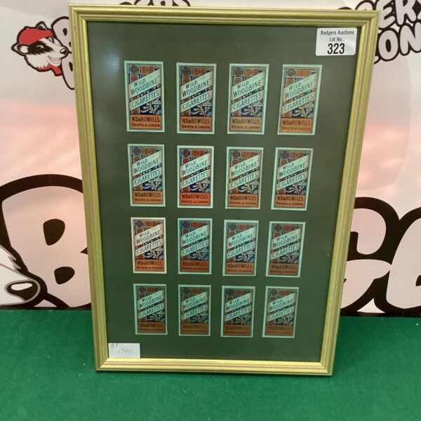 Framed collection of vintage Woodbine cigarette cards for collectors.