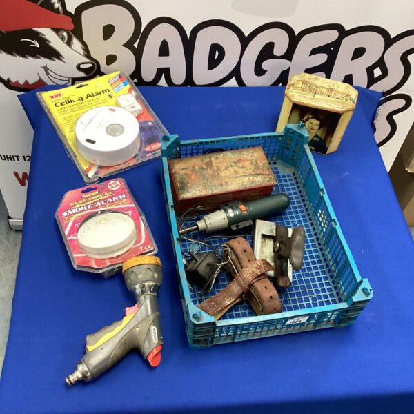 Mixed lot of household items including a smoke alarm and tools.