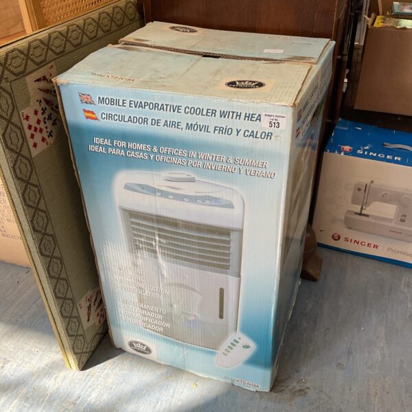 Vintage Singer KTS-N18A evaporative cooler unit in used condition.