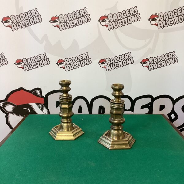 Elegant Ralph Lauren brass candlesticks for home decor and ambiance.