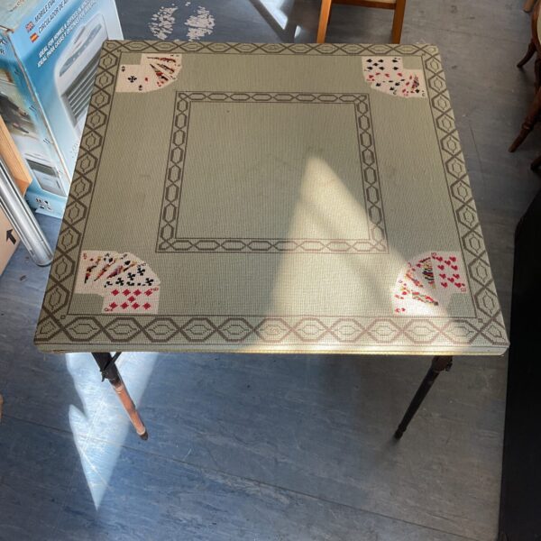Vintage folding card table, ideal for game nights and portable use.