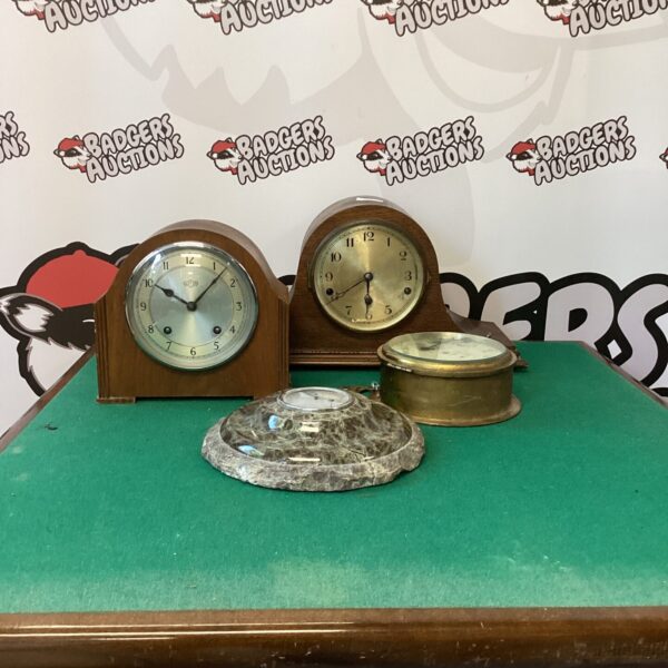 Vintage clock lot for restoration, including a Garrard timepiece.
