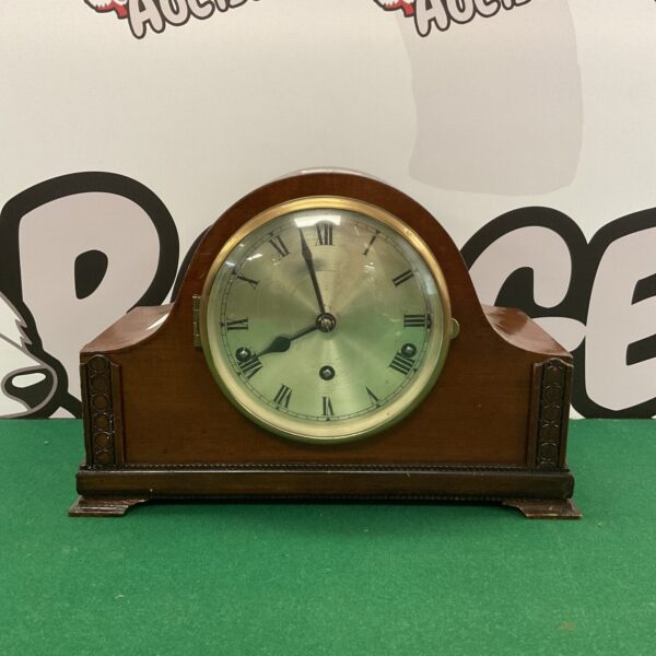 Vintage German Urgos mantle clock with wooden case.