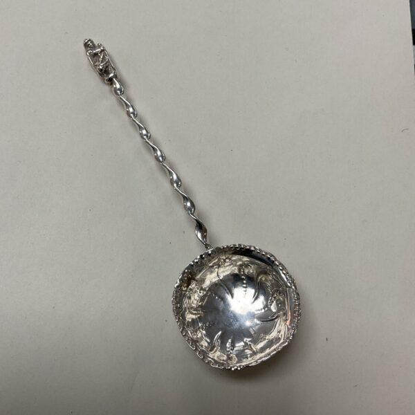 Victorian silver Apostle spoon with detailed bowl and twisted handle.