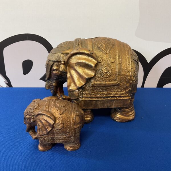 Detailed resin elephant ornaments, decorative pair for home decor.