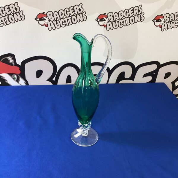 Vintage green Murano glass carafe with elegant flared base.