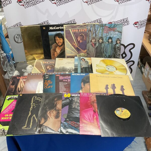 Vintage vinyl record lot including John Lennon and George Harrison records.