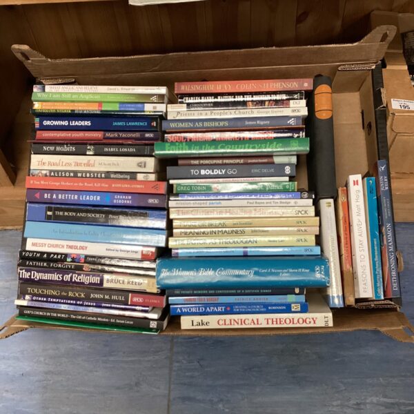Tray of religious books including "Touching the Rock".