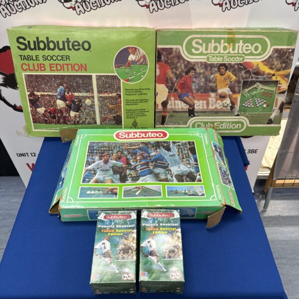 Vintage Subbuteo football game set with playing surface and figures.