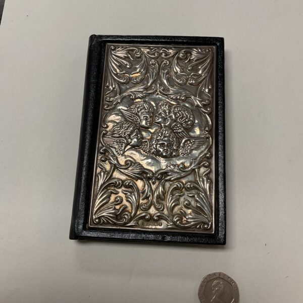 Vintage silver address book with cherub design, hallmarked silver.