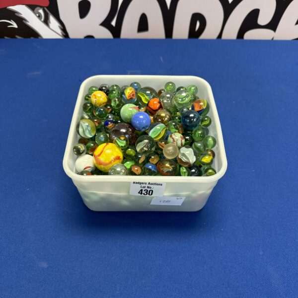 Vintage marbles lot in a margarine tub, colourful glass marbles.