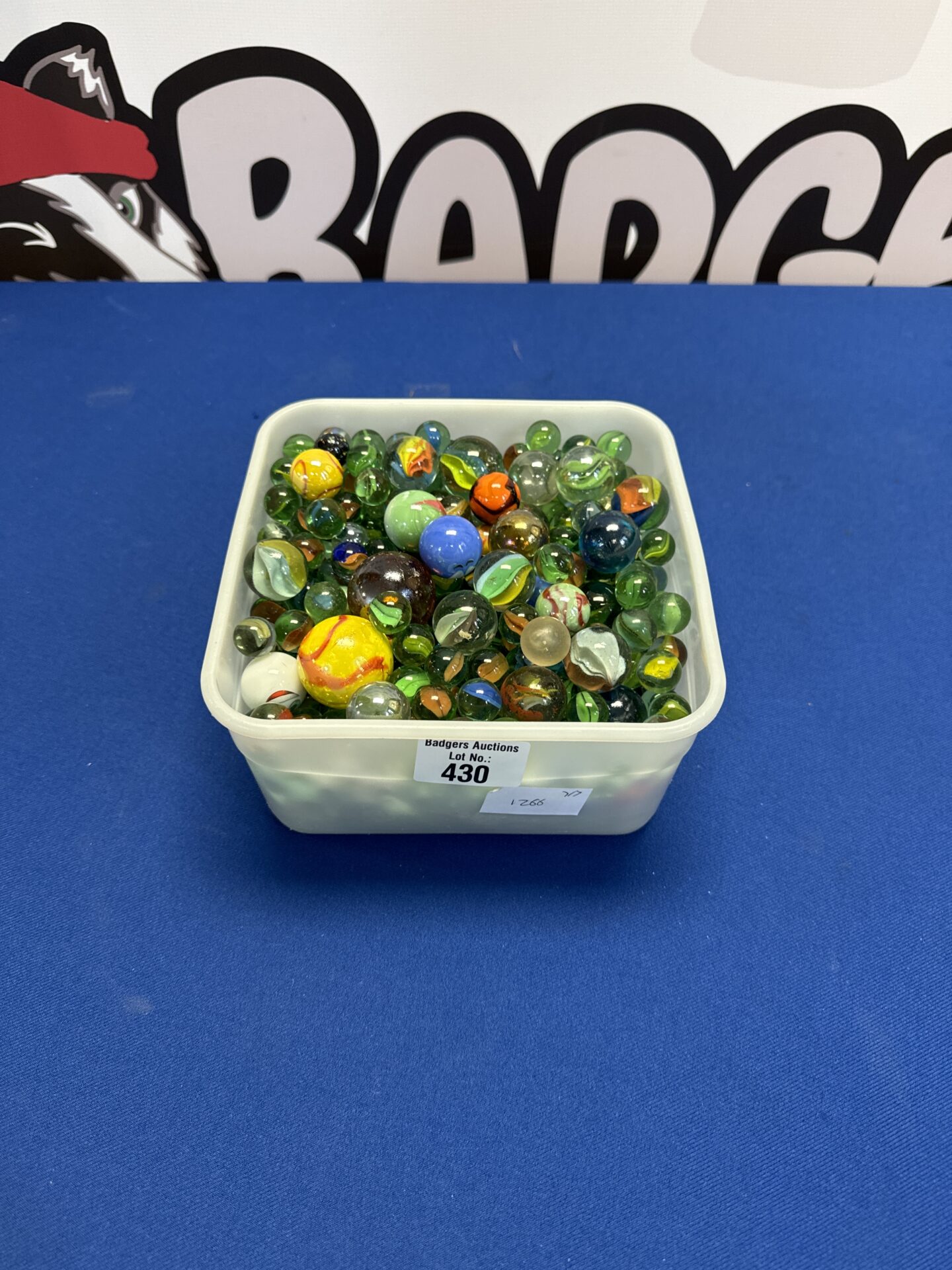 430 Margarine tub full of vintage marbles
