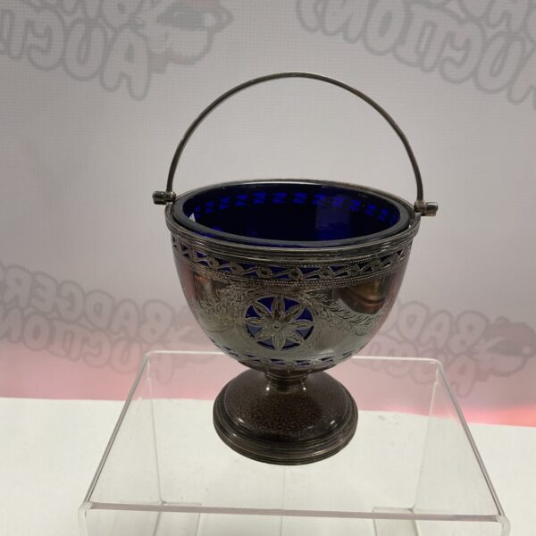 Antique Chester silver pedestal basket with blue glass liner.