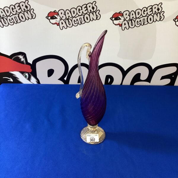 Vintage Murano glass carafe with amethyst hue and delicate handle.