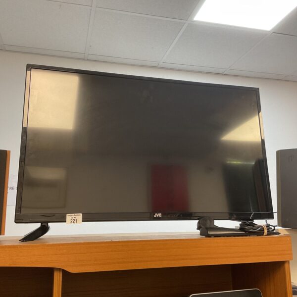 JVC 32 inch HD television with built-in DVD player.
