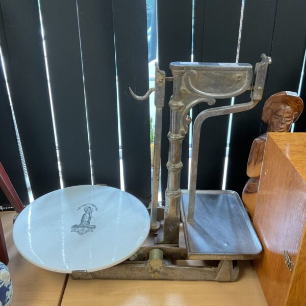 Antique Victorian justice scales with circular pan.