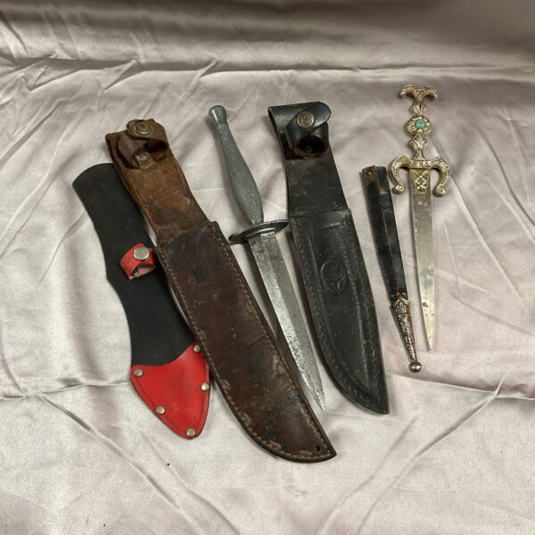 Vintage knife sheaths and blades, Commando and Spanish Toledo styles.