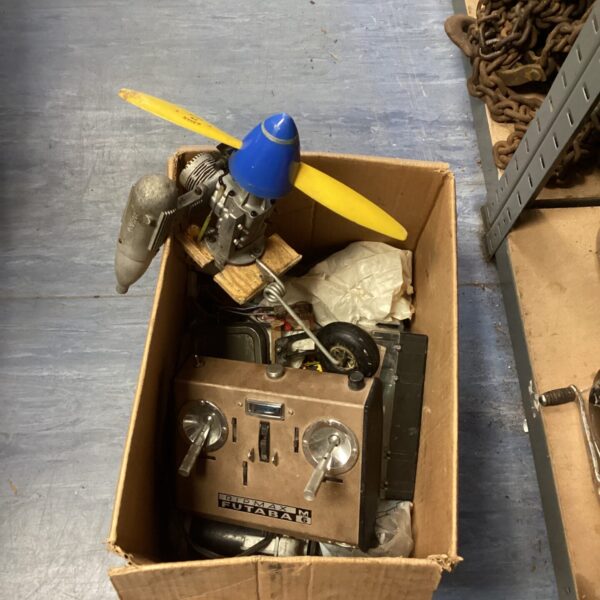Vintage model aeroplane spares lot with engine parts.