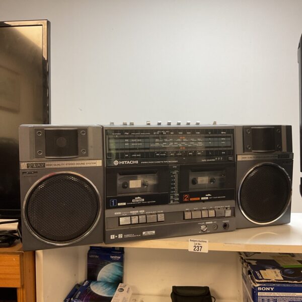 Vintage Hitachi boombox with double cassette player and radio.