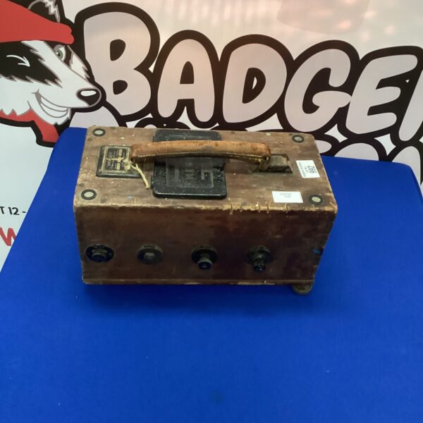 Vintage Megger Evershed testing kit in mahogany case, electrical equipment.