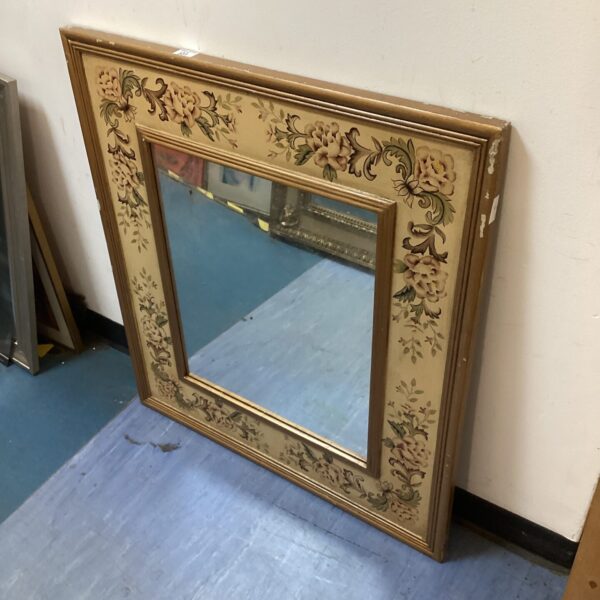 Vintage floral framed mirror for home decor.