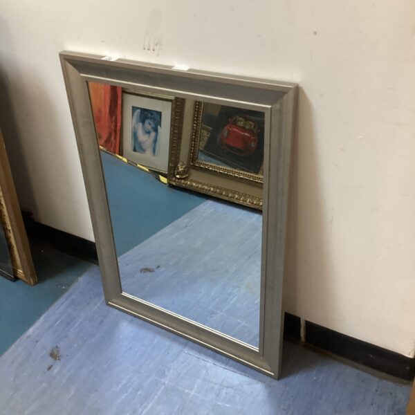 Vintage silver framed mirror for home decor.