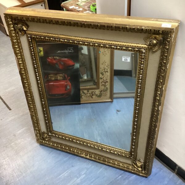 Ornate antique gilt framed mirror, vintage wall decor.
