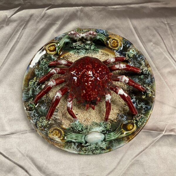Antique majolica plate with a sculpted red crab.