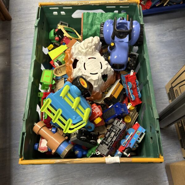 Crate filled with a diverse collection of children’s plastic toys.