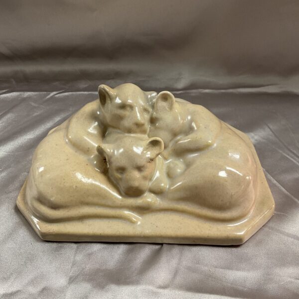 Front view of studio art pottery lionesses plaque.