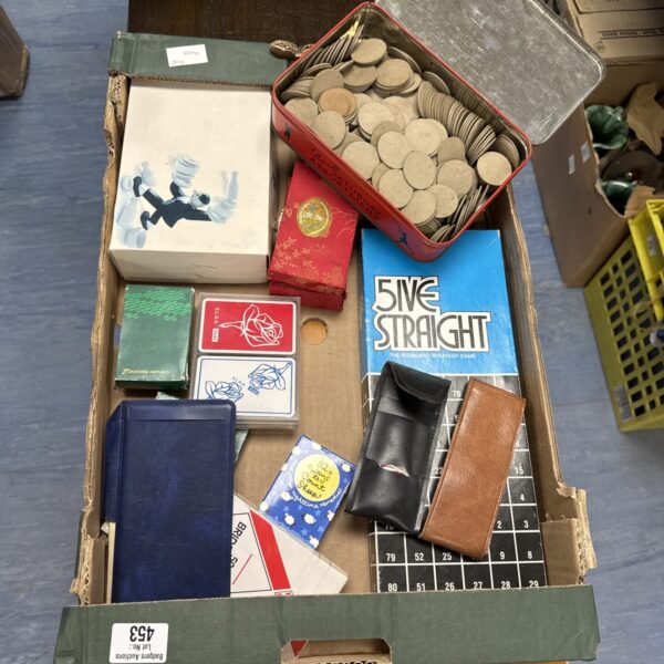 Vintage board games lot with colourful boxes and components.
