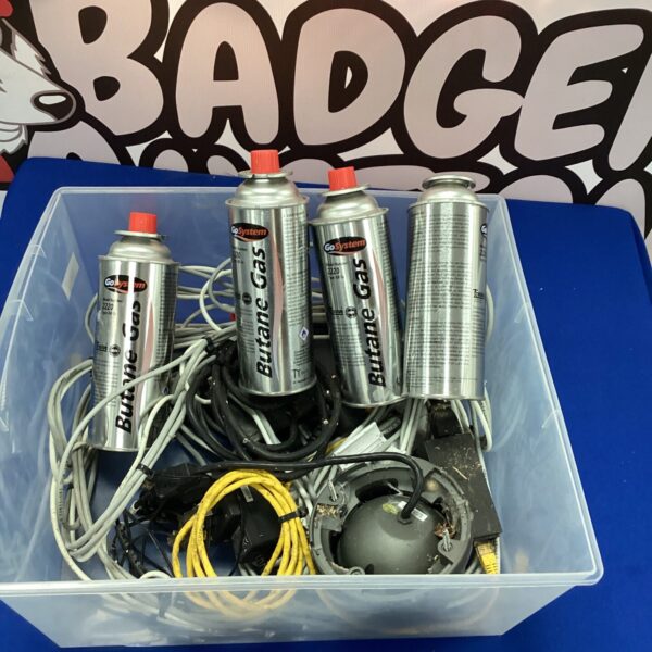 Mixed lot of butane gas canisters for camping and portable stoves.