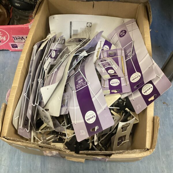 Lot of metal display plate wire for retail use.